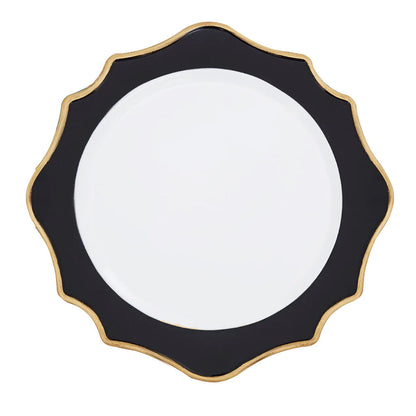 White and black charger plate laid beneath a dinner plate