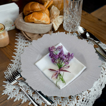 White reef charger plates stacked showing the textured rim