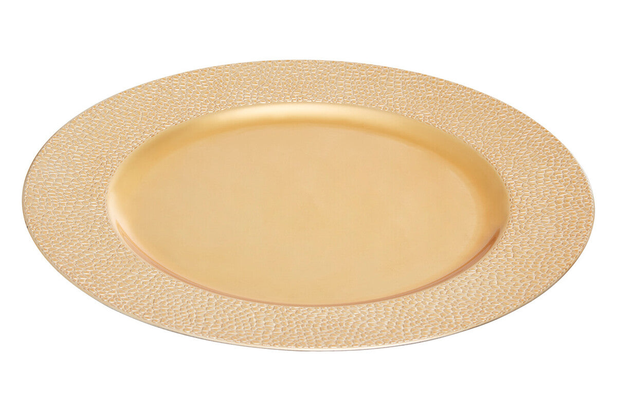 Gold charger plates styled with tableware for a formal dinner