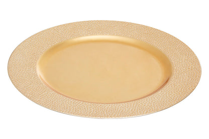 Gold charger plates styled with tableware for a formal dinner