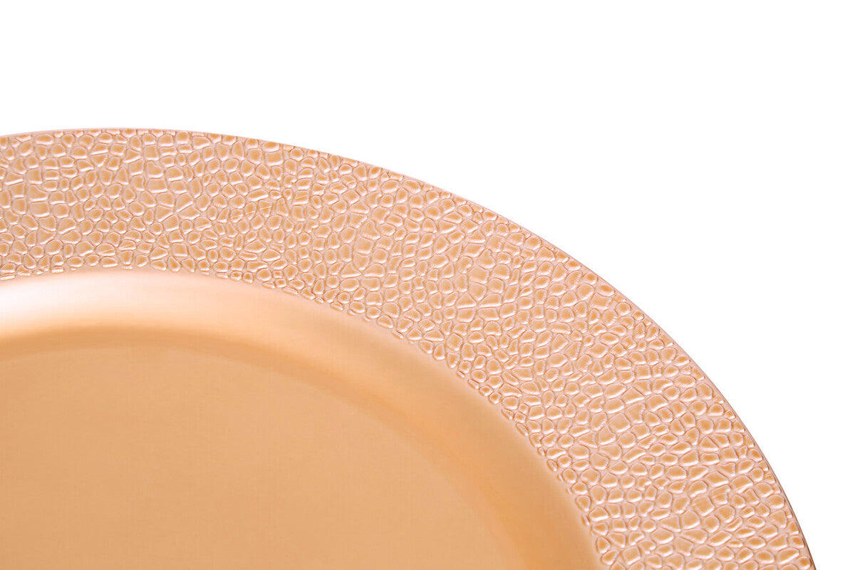 Rose gold charger plates styled with tableware for a formal dinner