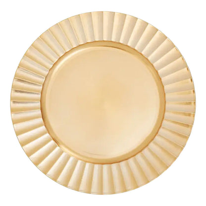 Gold charger plate laid beneath a dinner plate in a place setting