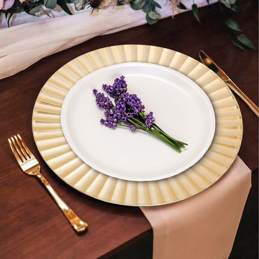 Gold wave charger plates stacked showing the fluted rim
