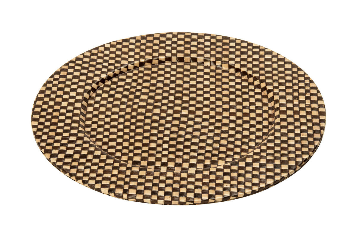 Black and natural charger plate laid beneath a dinner plate