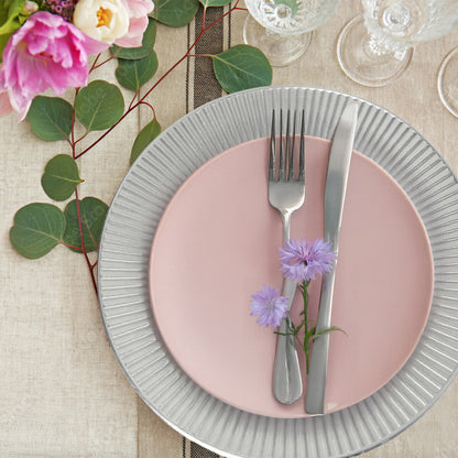 Silver Redbud charger plate styled on a dining table