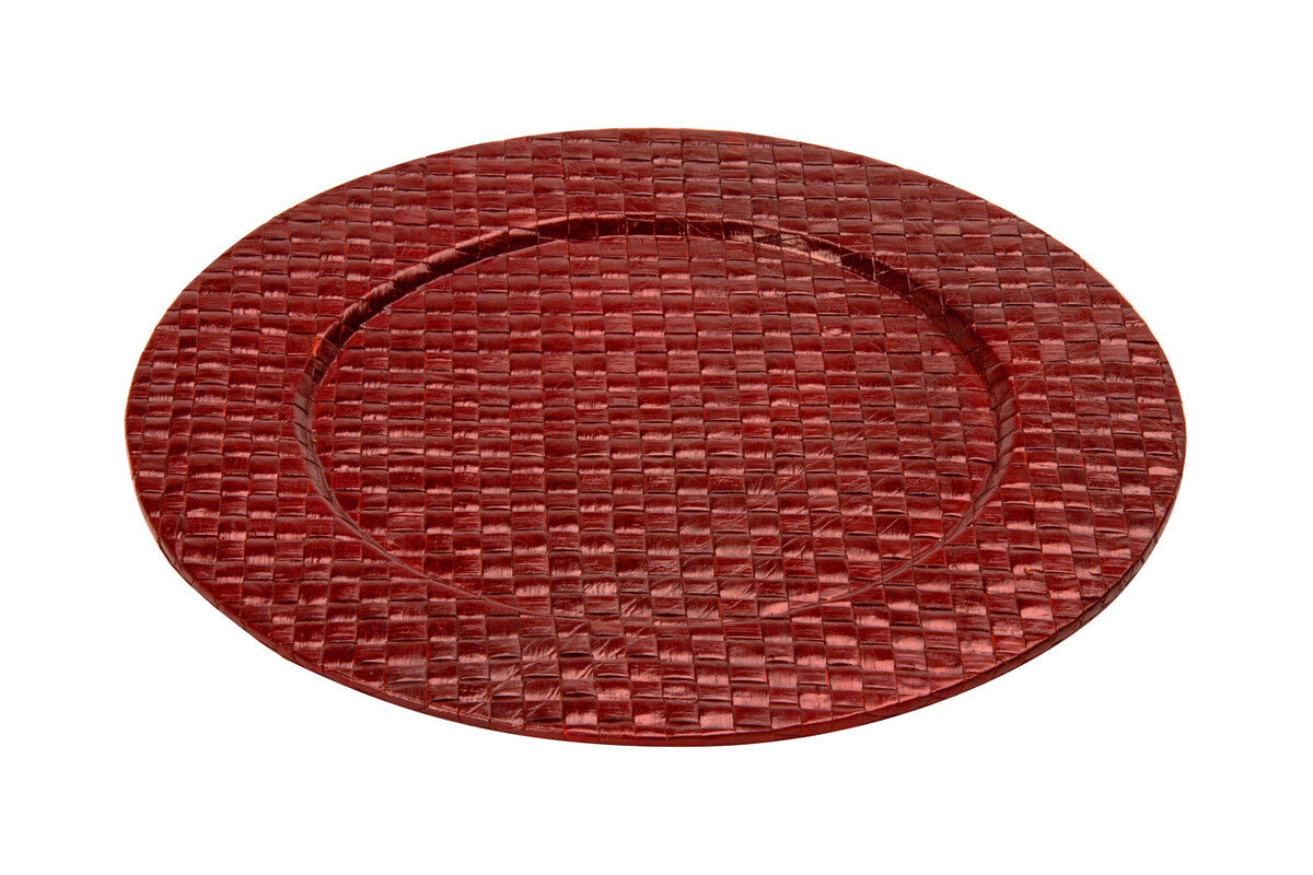 Red charger plate laid beneath a dinner plate