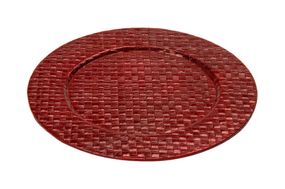 Red charger plate laid beneath a dinner plate