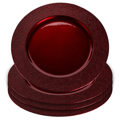 Red charger plates styled with tableware for a festive dinner