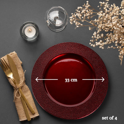 Close-up detail of the pebble-effect texture on the red charger plate