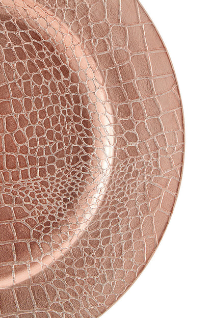 Rose gold charger plates styled with tableware for a formal dinner