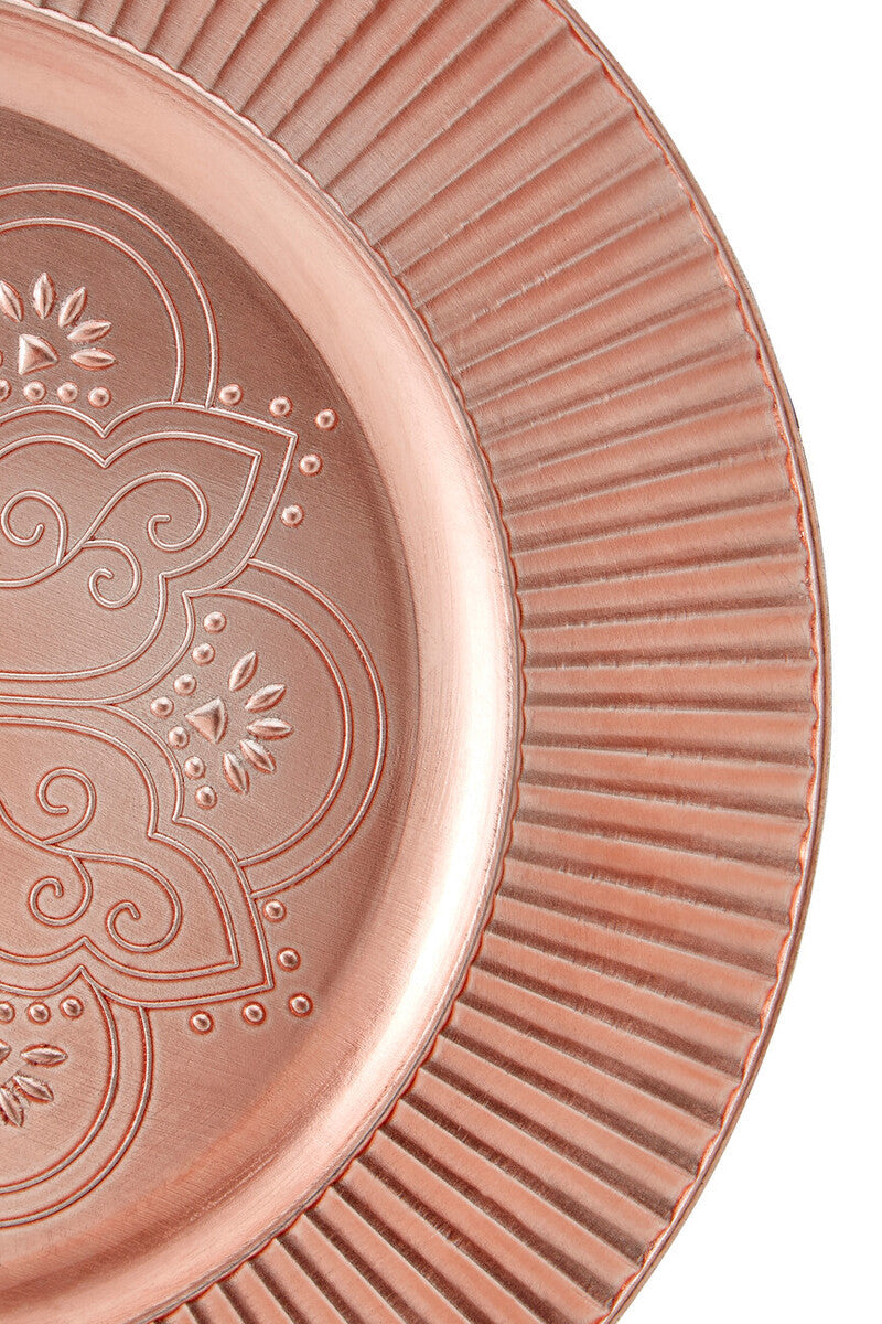 Rose gold charger plates styled with tableware for a formal dinner