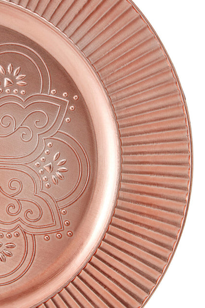 Rose gold charger plates styled with tableware for a formal dinner