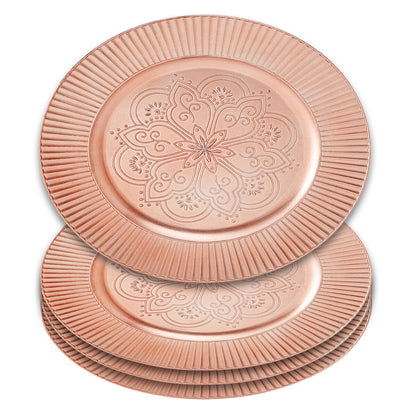 Close-up detail of the arabesque pattern on the rose gold charger plate