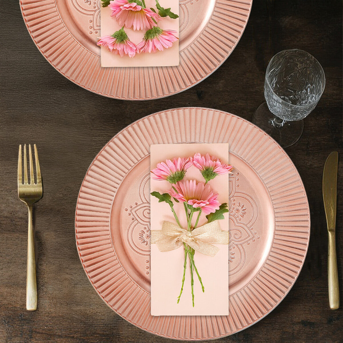 Rose gold charger plate shown from above with etched pattern visible