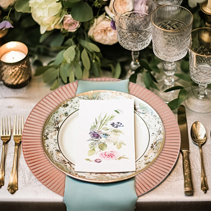 Rose gold charger plates stacked showing the arabesque pattern