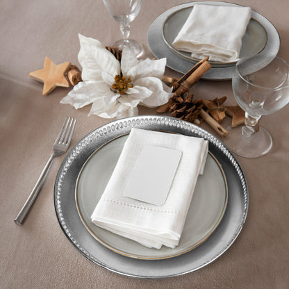 Silver decorative charger plate shown from above