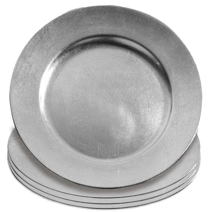 Silver charger plates styled with tableware for a formal dinner