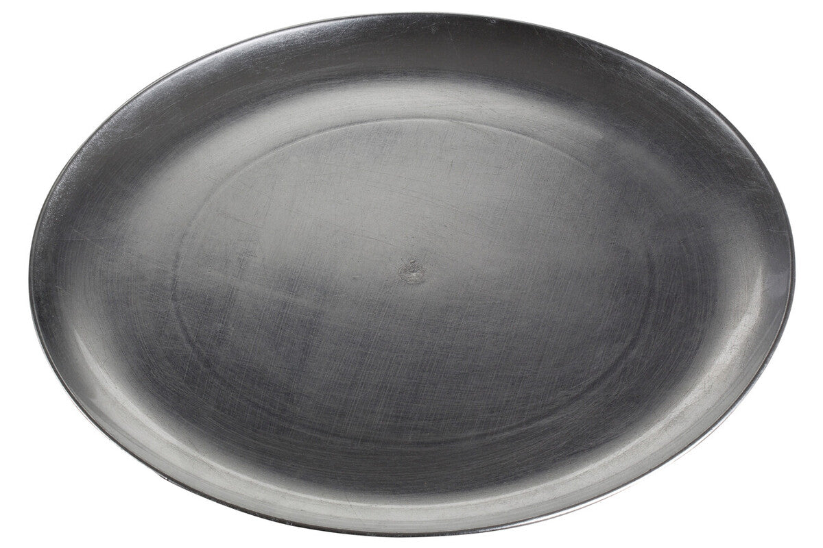 Silver coupe charger plate laid beneath a dinner plate in a place setting