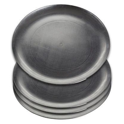 Silver coupe charger plates styled with tableware for a formal dinner