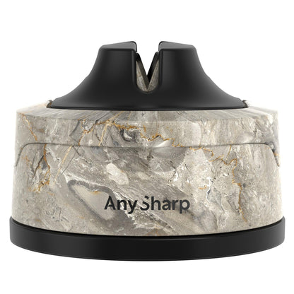 Marble-patterned sharpener with black top on a white background