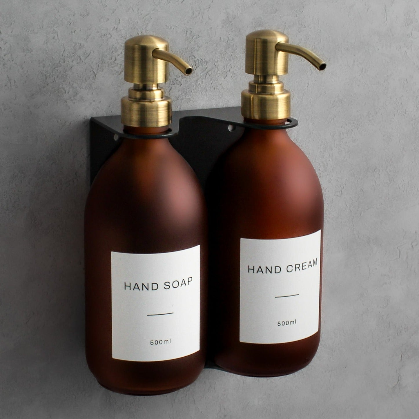 Namie Matte Black Wall Mounted Dispenser Bracket Set with Frosted Amber Glass Bottles