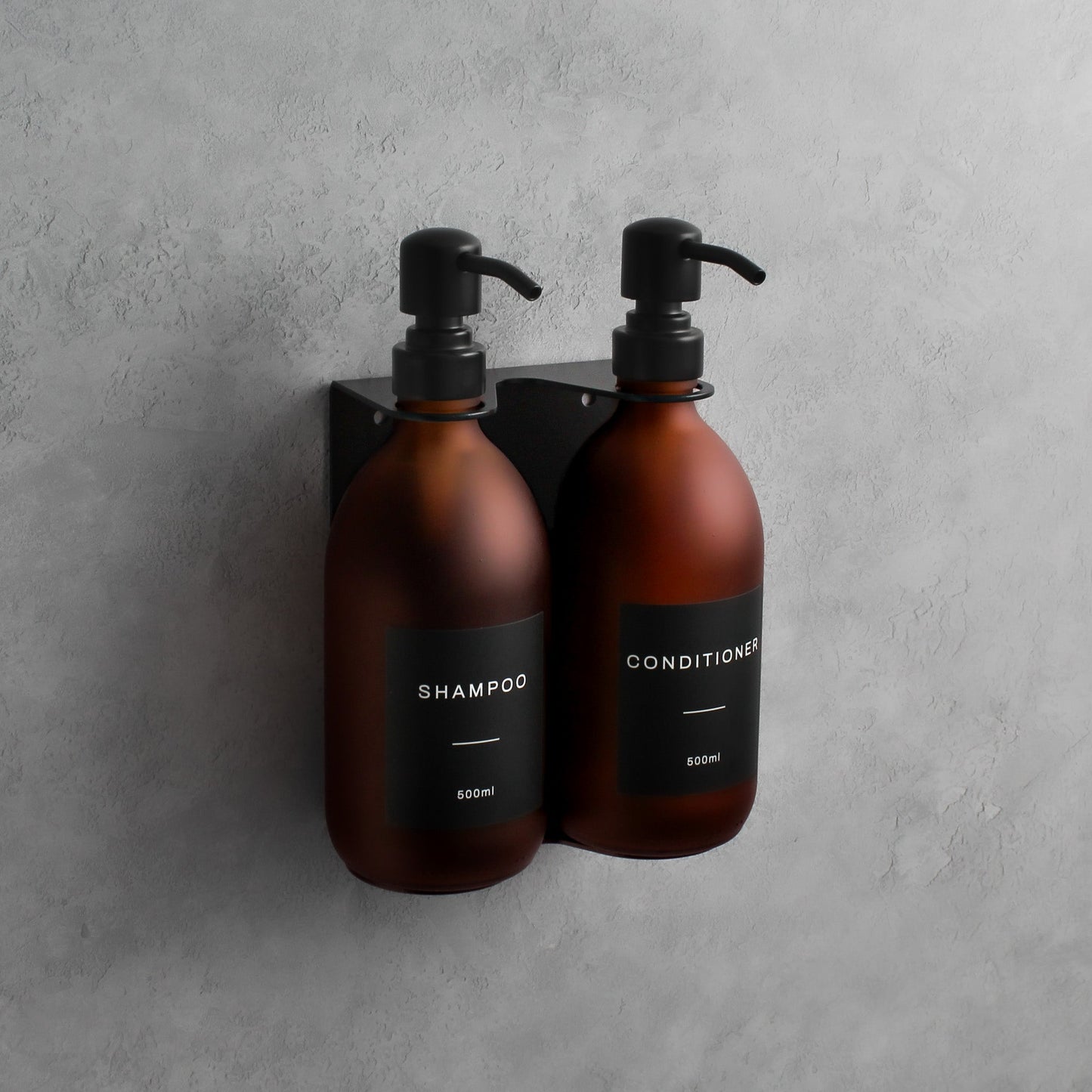 Namie Matte Black Wall Mounted Dispenser Bracket Set with Frosted Amber Glass Bottles