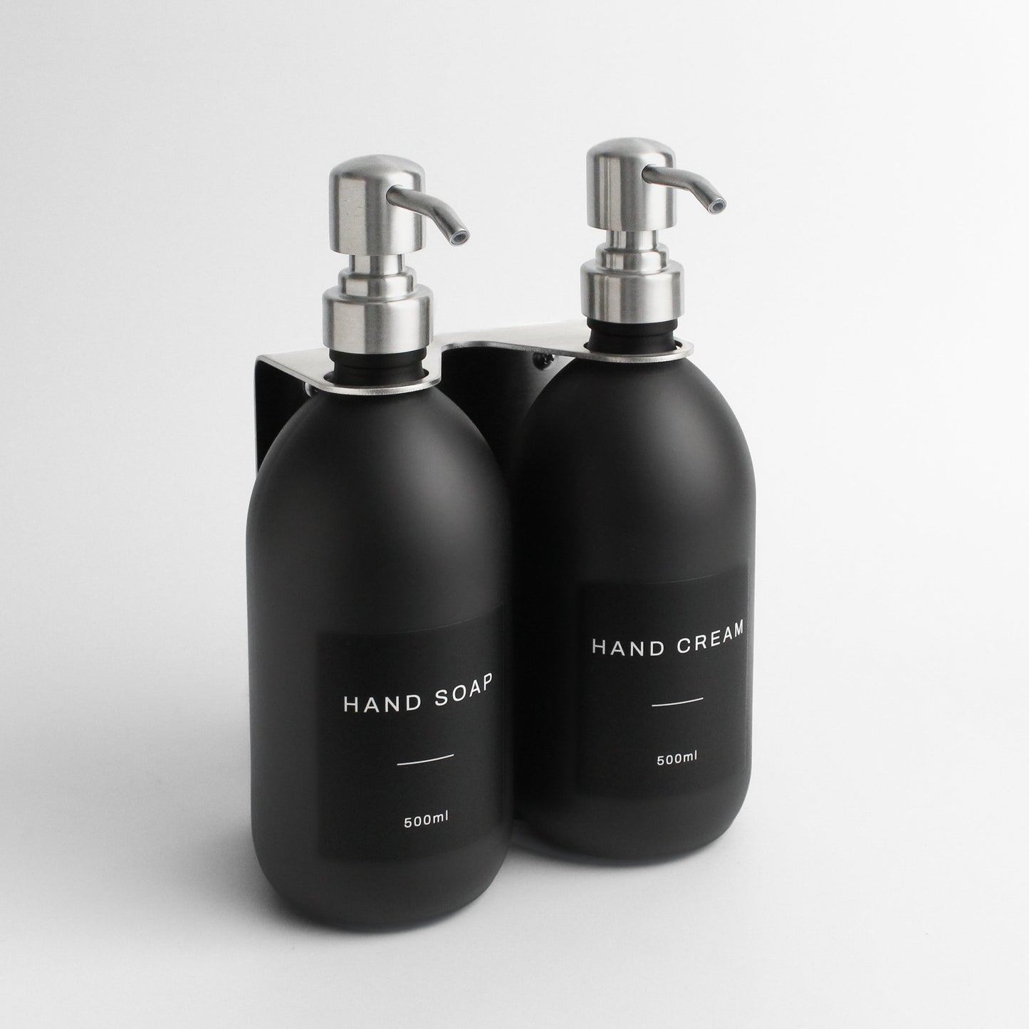 Namie Silver Wall Mounted Dispenser Bracket Set with Matte Black Bottles