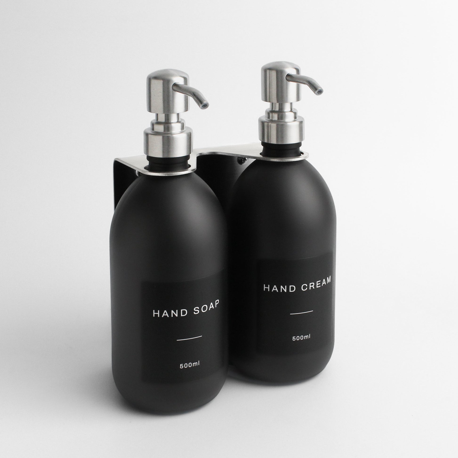 Namie Silver Wall Mounted Dispenser Bracket Set with Matte Black Bottles