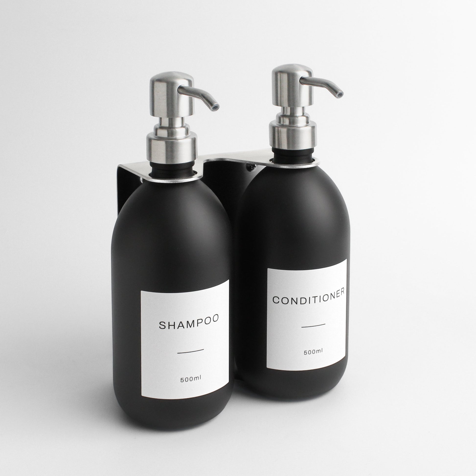 Namie Silver Wall Mounted Dispenser Bracket Set with Matte Black Bottles