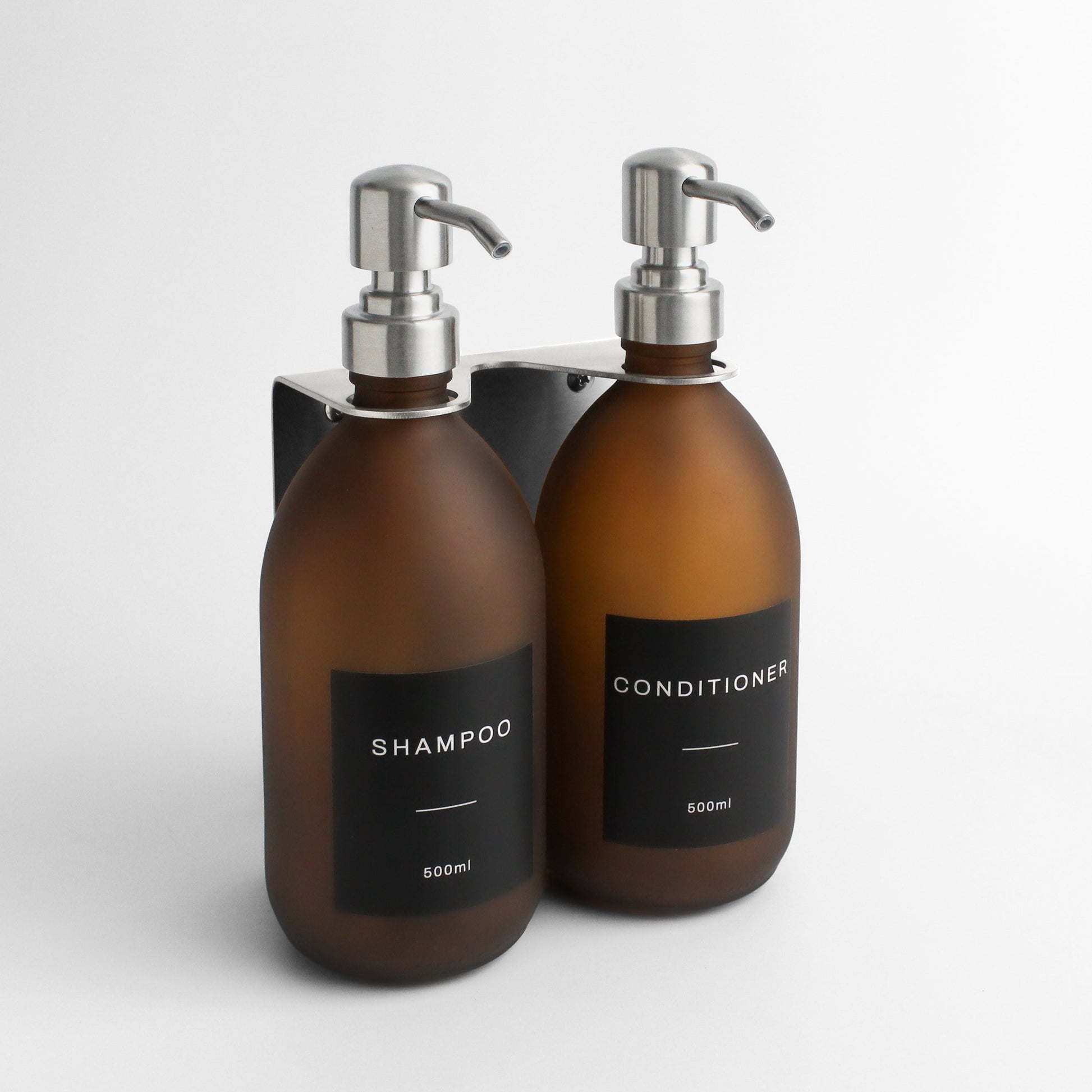 Namie Silver Wall Mounted Dispenser Bracket Set with Frosted Amber Glass Bottles
