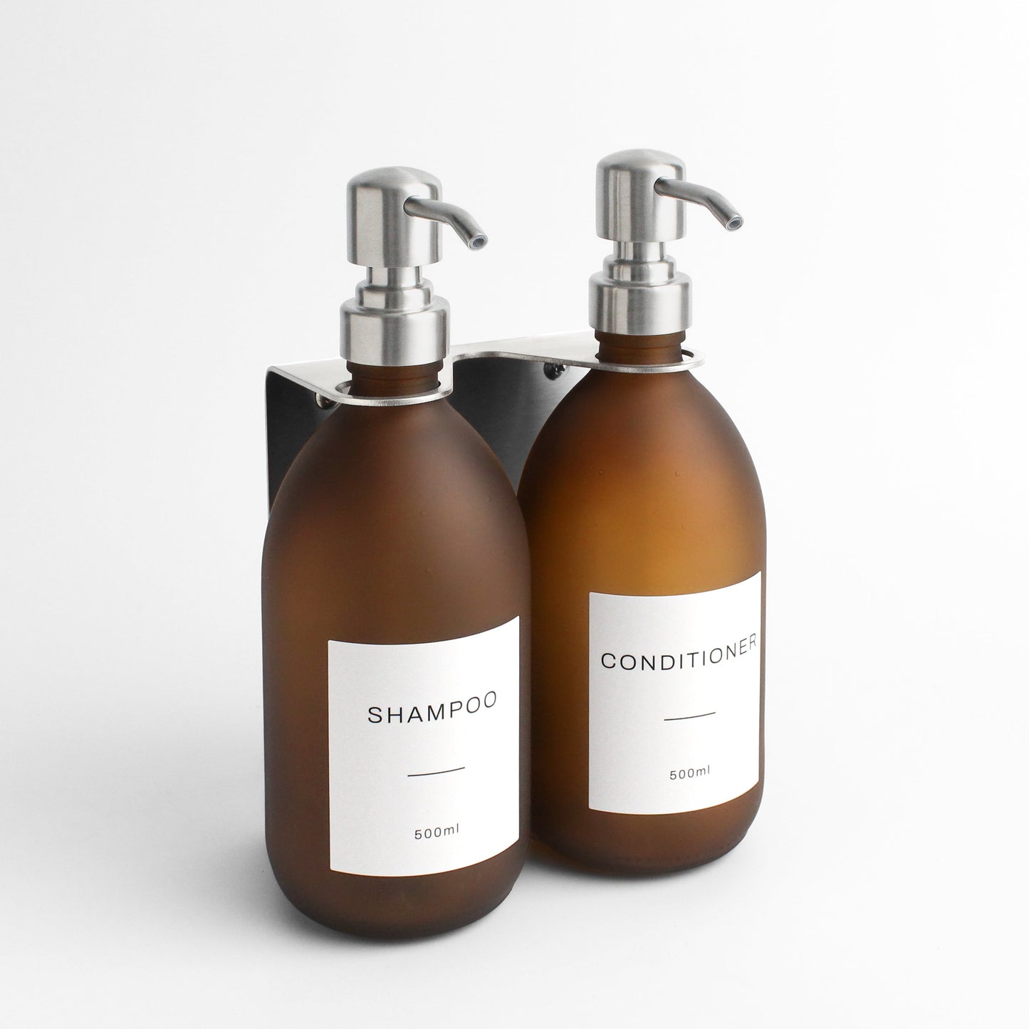 Namie Silver Wall Mounted Dispenser Bracket Set with Frosted Amber Glass Bottles