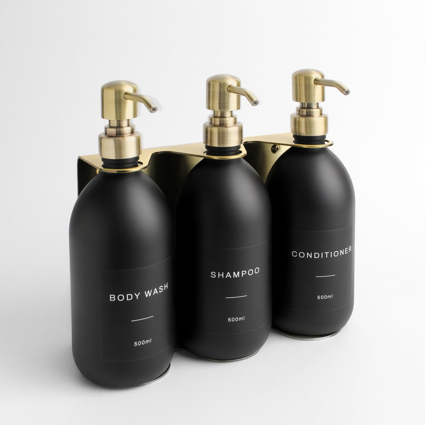 Namie Gold Wall Mounted Dispenser Bracket Set with Matte Black Bottles