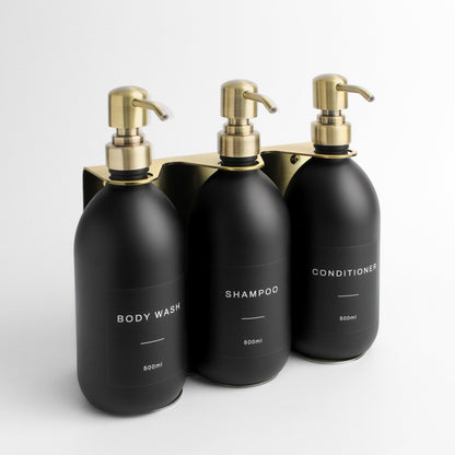 Namie Gold Wall Mounted Dispenser Bracket Set with Matte Black Bottles