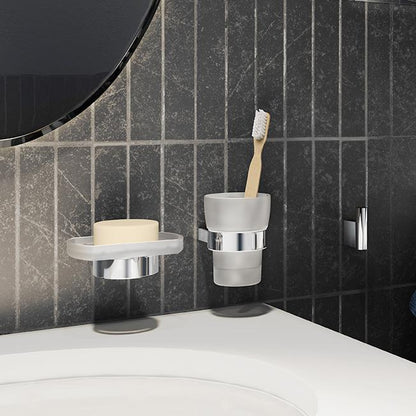 Bathroom basin with Smedbo Air wall-mounted toothbrush holder, soap dish, and hook on a tiled wall.