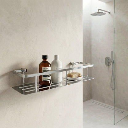Smedbo Sideline DK3005 Wide Polished Chrome Shower Basket — Wall-Mounted on Textured Plaster Wall Beside Frameless Glass Shower, Styled with Aesop Shampoo, Conditioner and Soap Bar