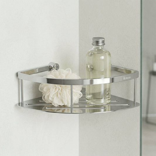 Smedbo Sideline DK3031 Polished Chrome Corner Shower Basket in Use — Curved Solid Tray Styled with Glass Bottle and Loofah in White Shower Corner