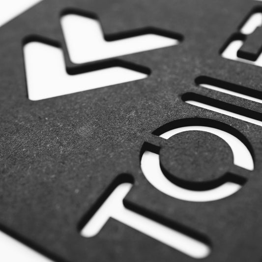 Black Decorative Toilet Sign with Left Arrow