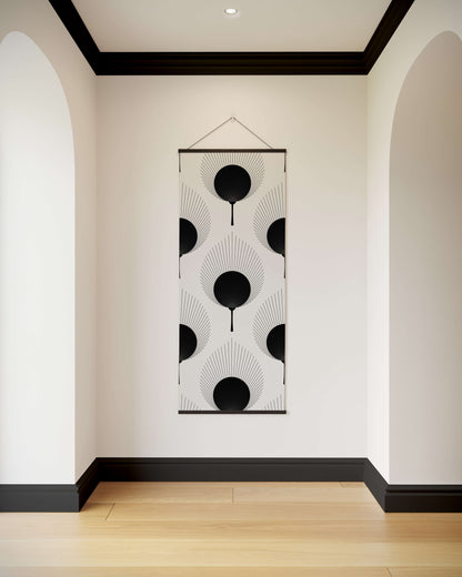 Decorative wall hanging with black and white pattern in a modern hallway.