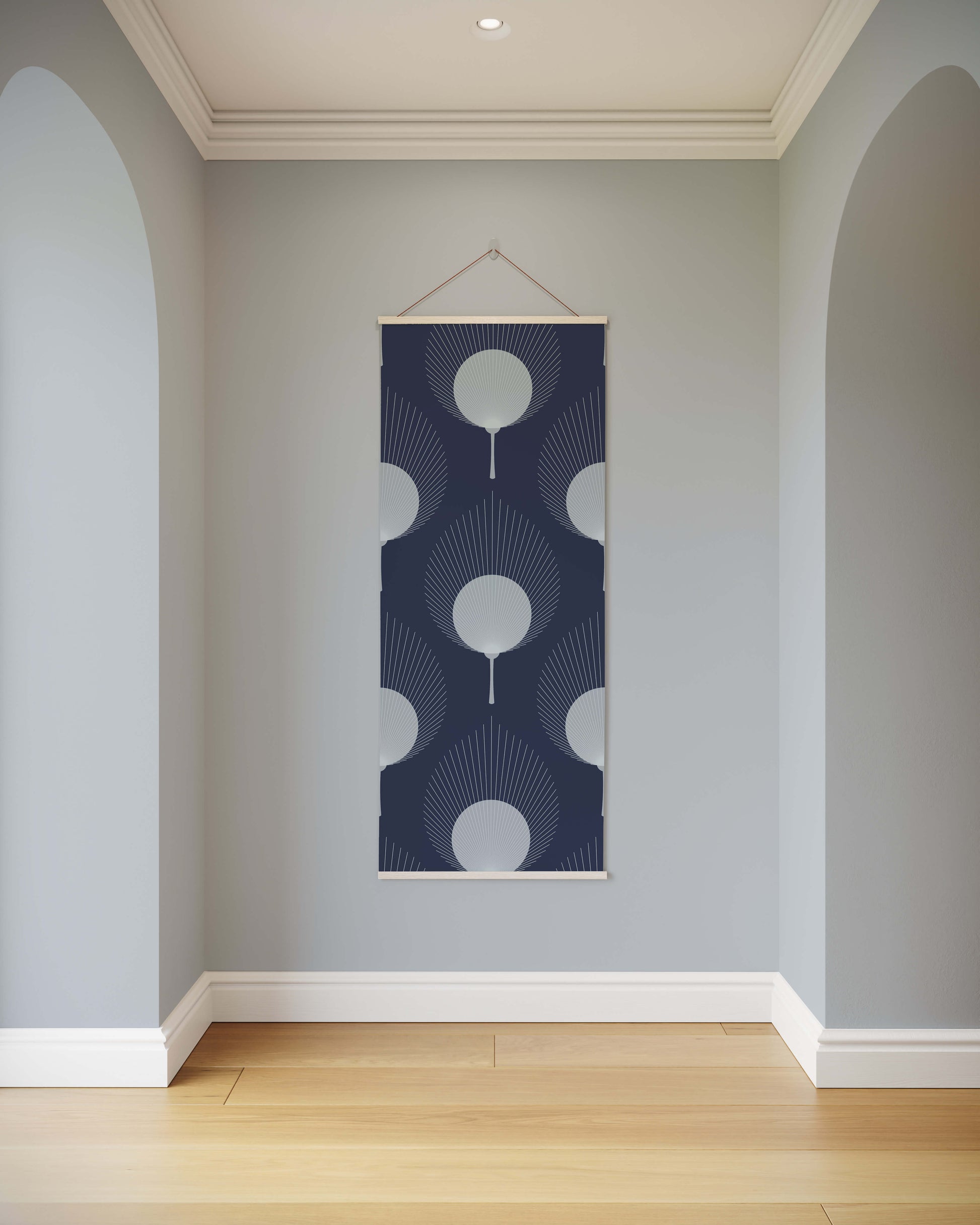 Decorative wall hanging with geometric pattern on a light gray wall.