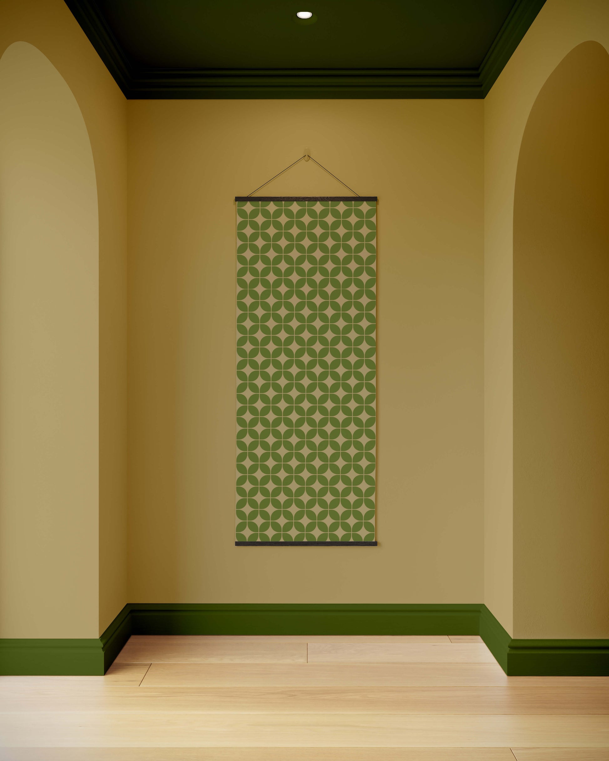 Green patterned tapestry hanging on a beige wall with green trim.