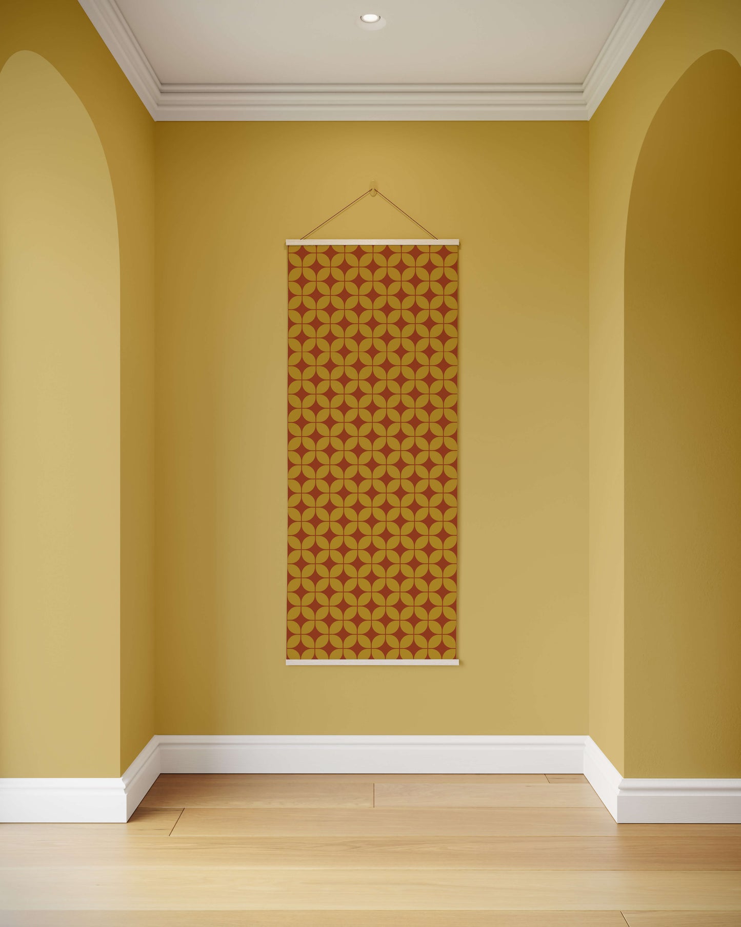 Wall with a patterned tapestry hanging on a yellow wall