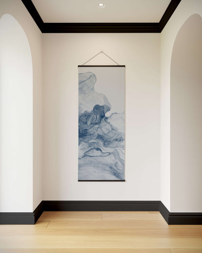 Wall art hanging in a room with white walls and wooden flooring