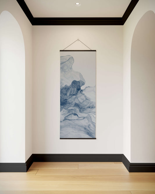 Wall art hanging in a room with white walls and wooden flooring