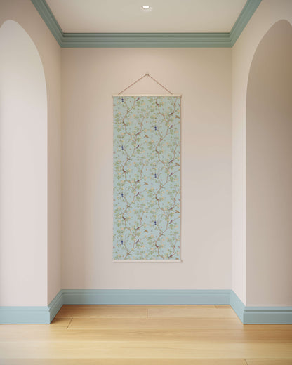 Wall with a floral patterned poster hanging on it