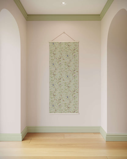 Decorative wall hanging with floral pattern on a plain wall.