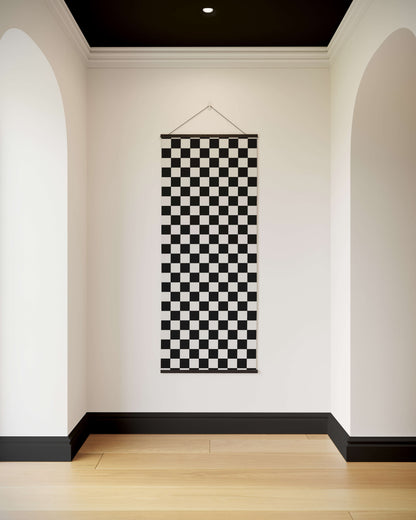 Checkerboard Pattern Tapestry hanging in a room with white walls and a wooden floor.