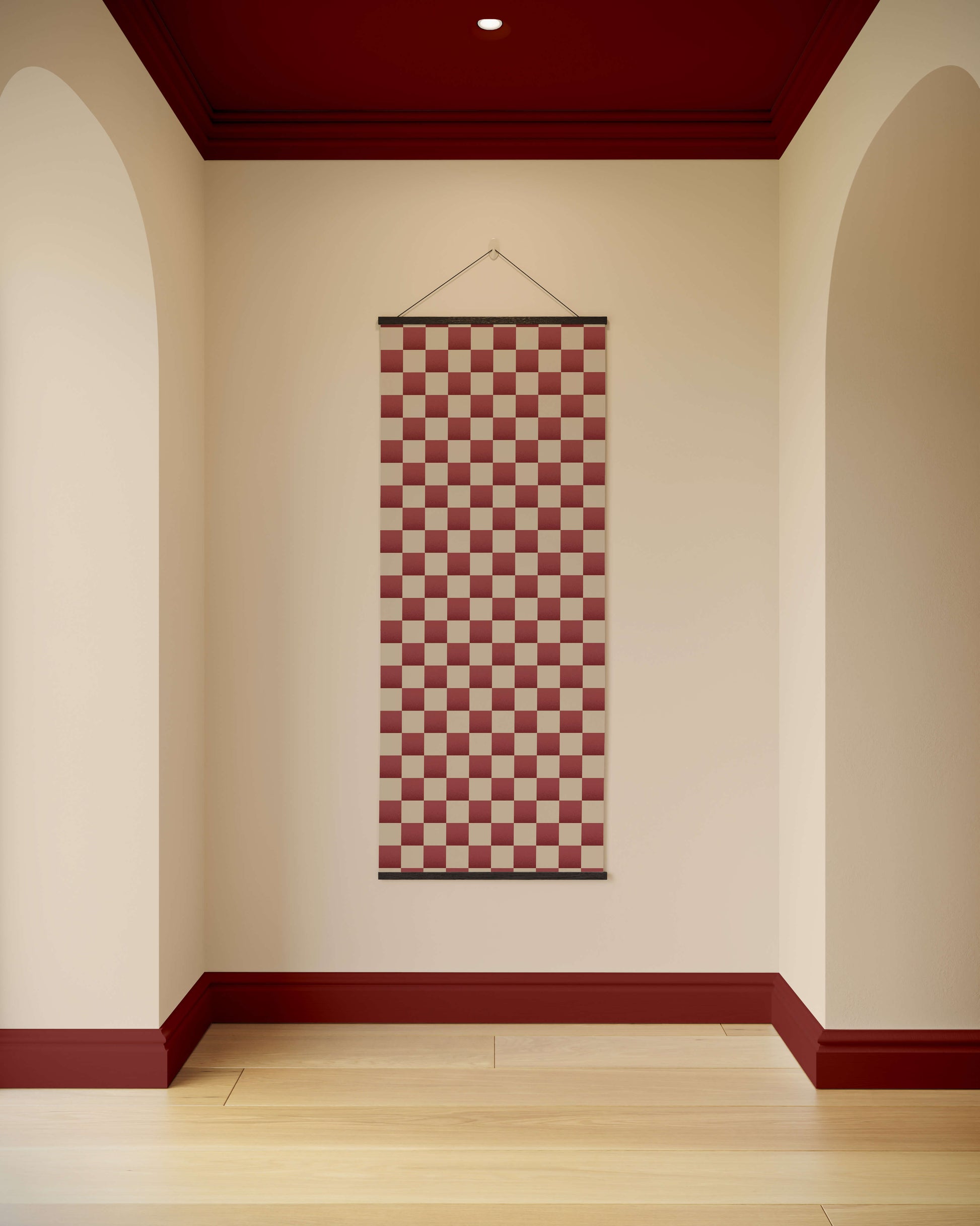 Checkered tapestry hanging on a wall with a red and white pattern