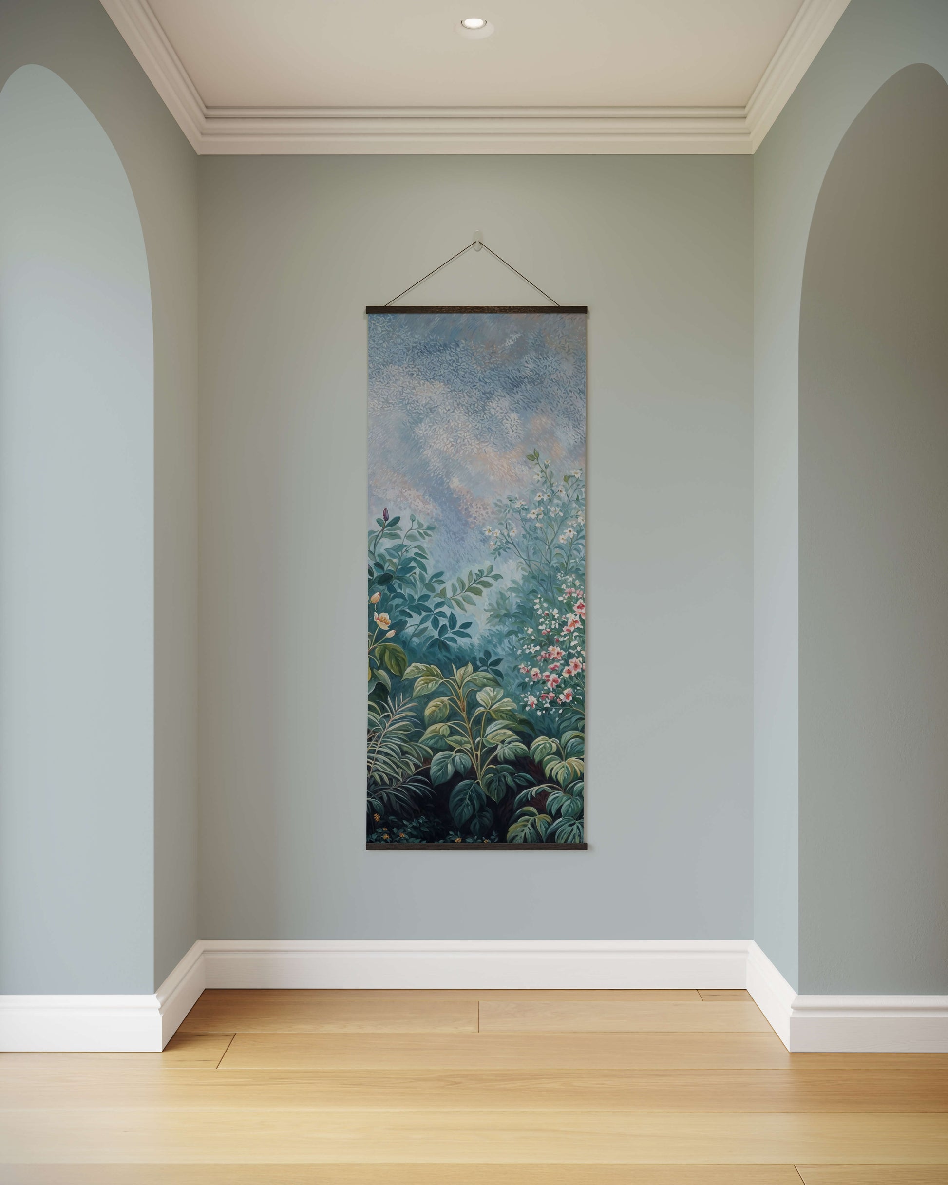 Floral tapestry hanging on a light blue wall in a room with wooden flooring.