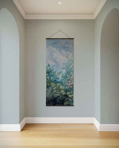Floral tapestry hanging on a light blue wall in a room with wooden flooring.