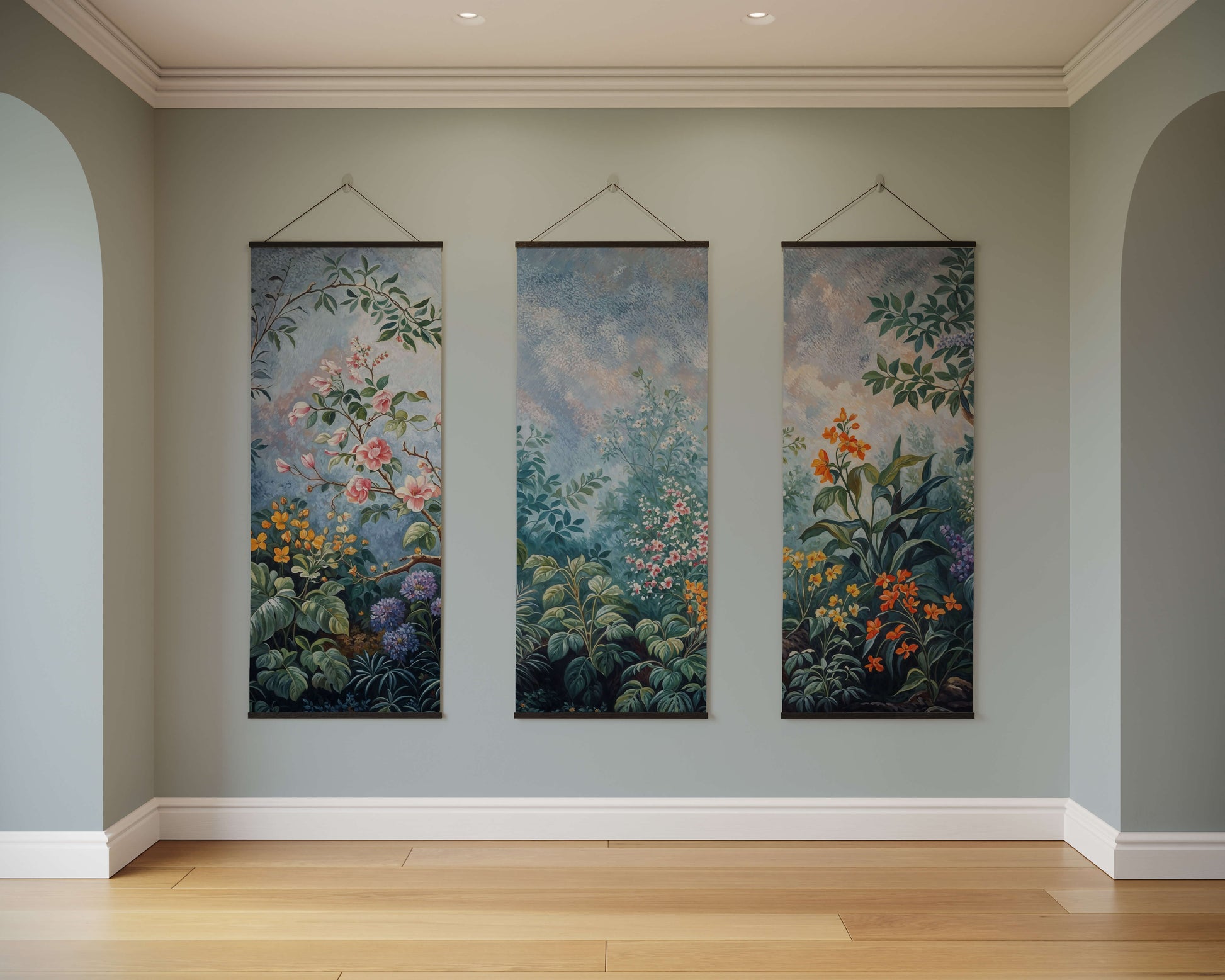 Three floral tapestries hanging on a wall in a room with wooden flooring.